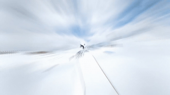 a blurry photo of a person walking on a train track