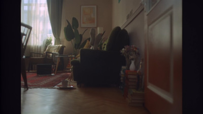 a living room filled with furniture and a fire place