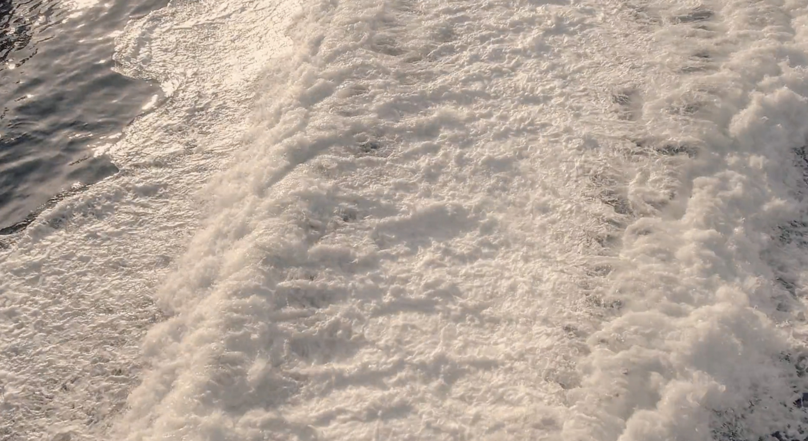 a person riding skis on a body of water