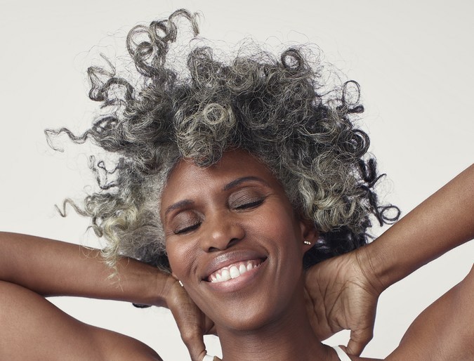 a close up of a person with curly hair