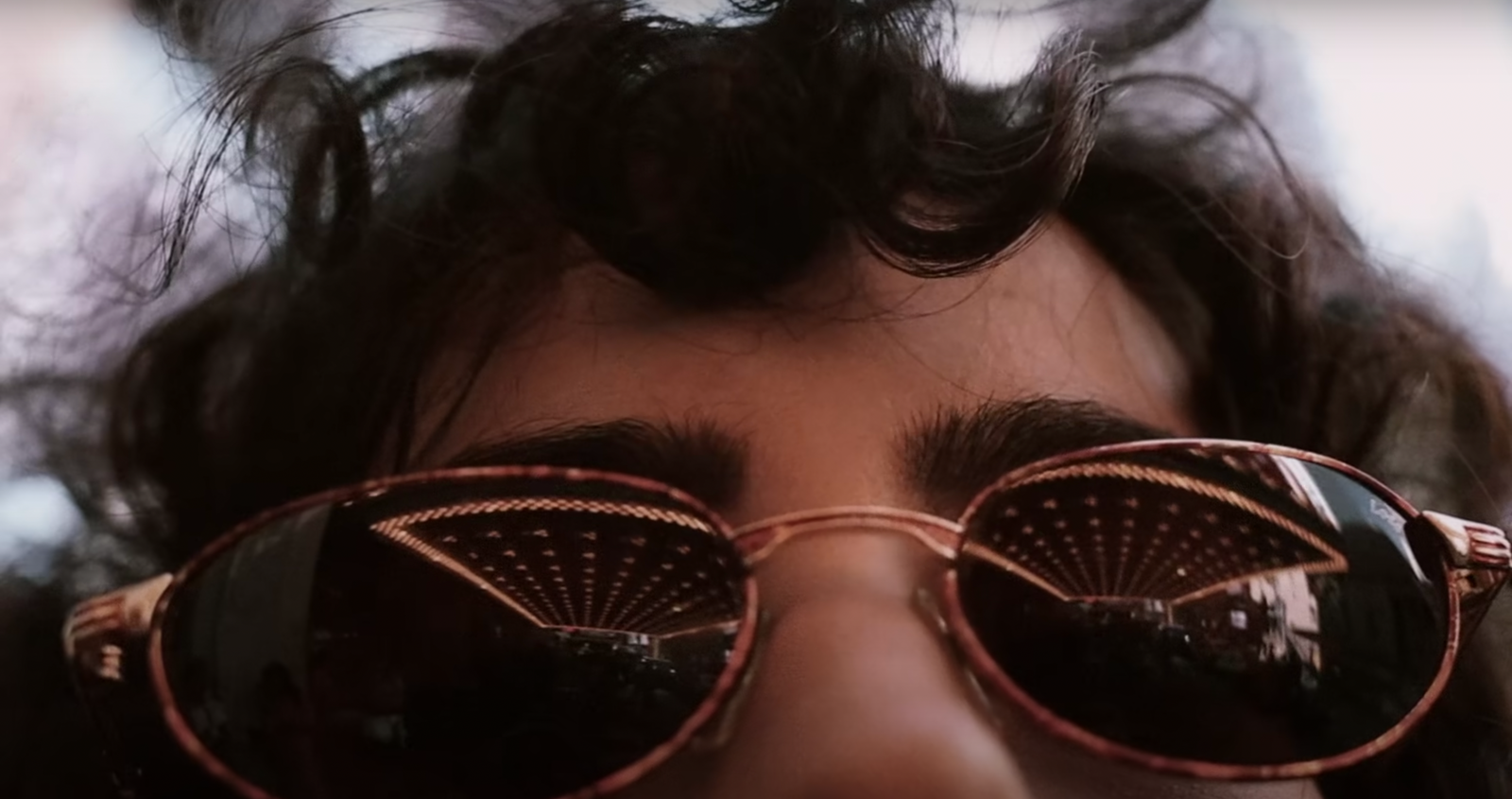 a close up of a person wearing sunglasses