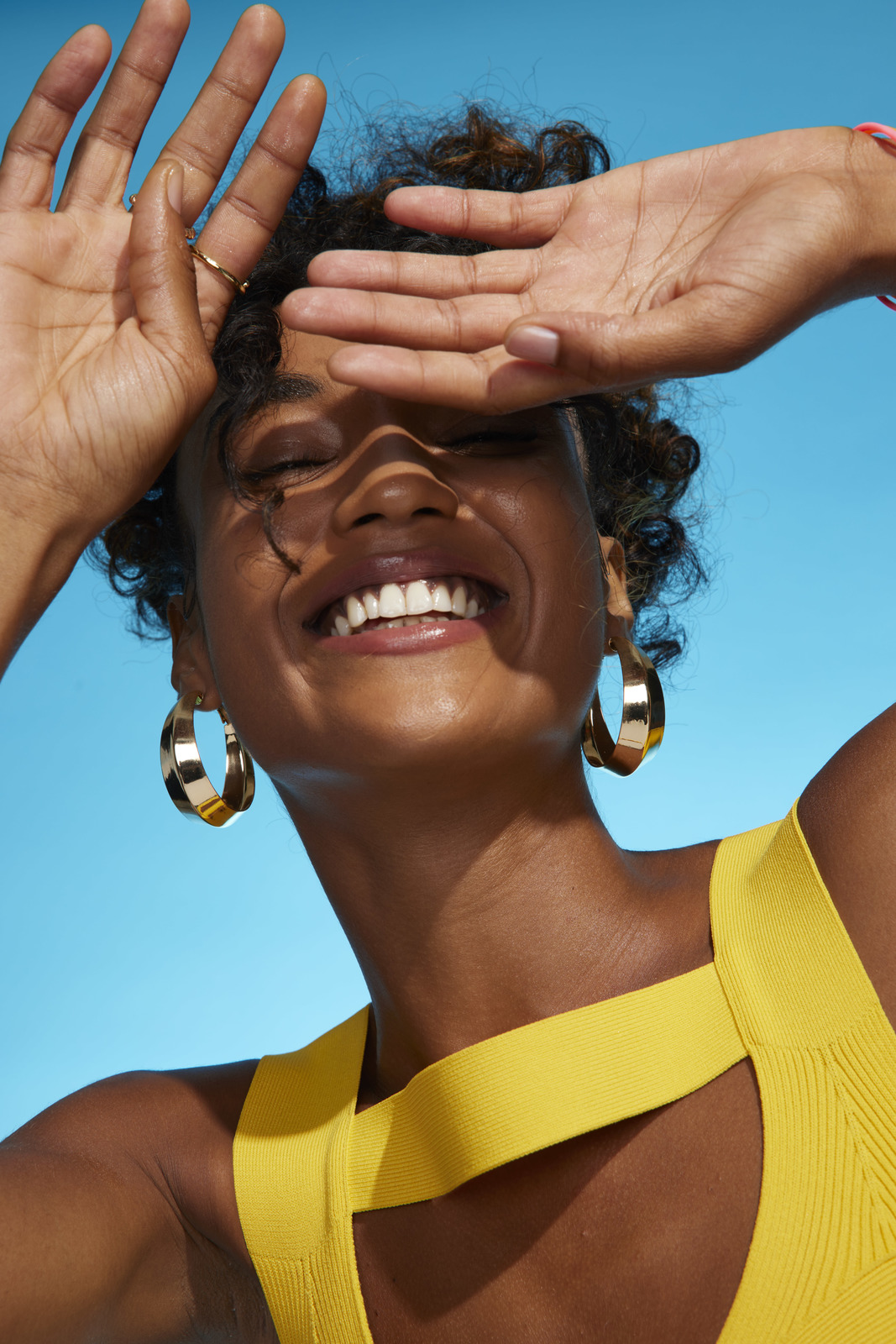 a woman with her hands on her head