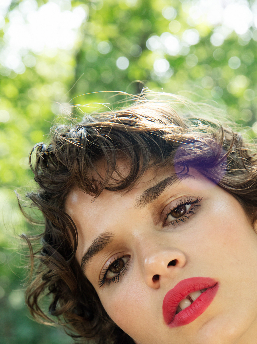 a close up of a person with a red lipstick