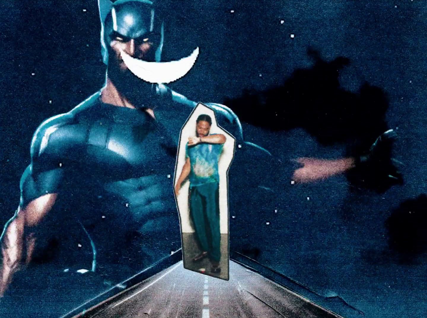 a man in a batman costume standing on a road