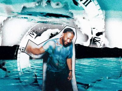 a man standing in the water with a clock in the background