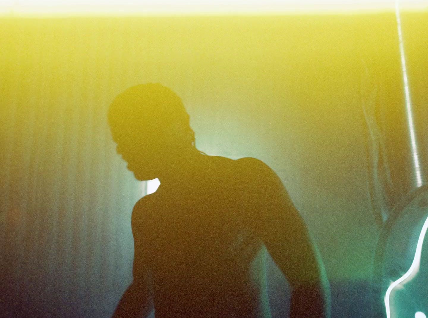 a silhouette of a person standing in a room