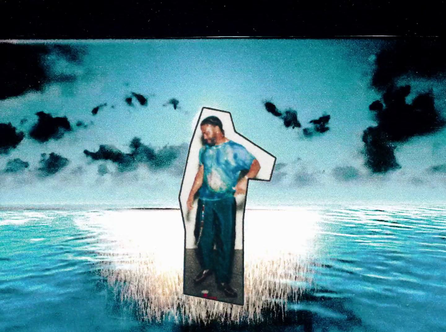 a man standing in the middle of a body of water