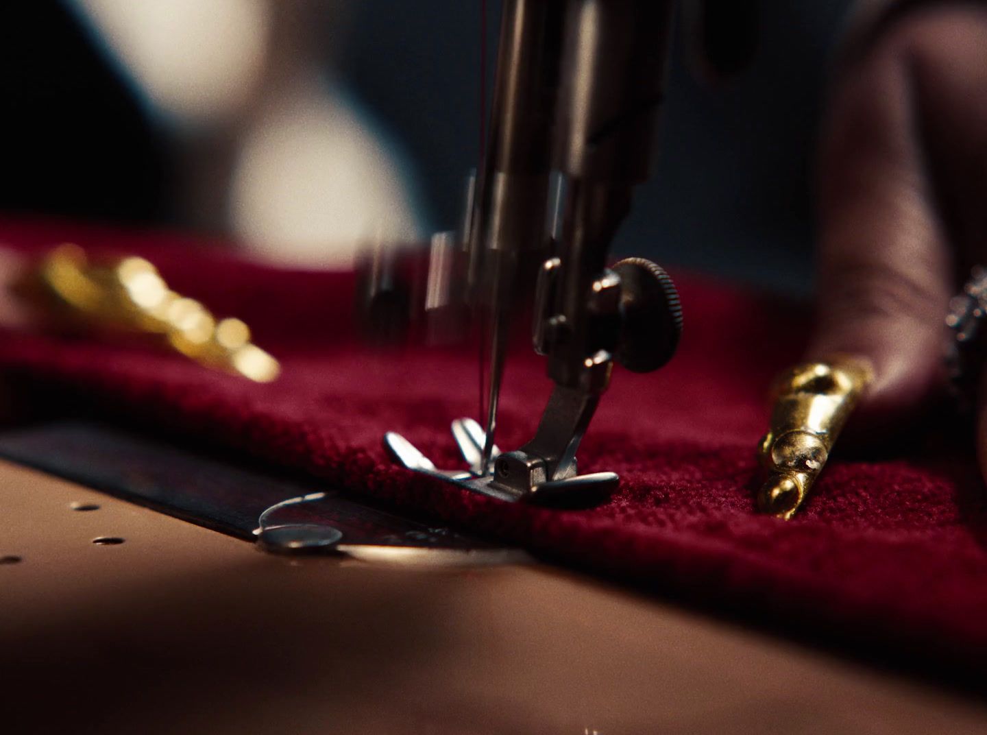 a close up of a person using a sewing machine