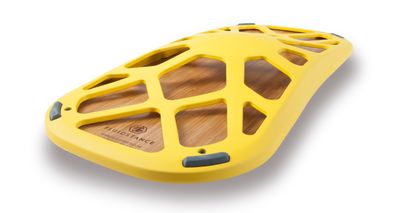 a close up of a yellow object on a white background