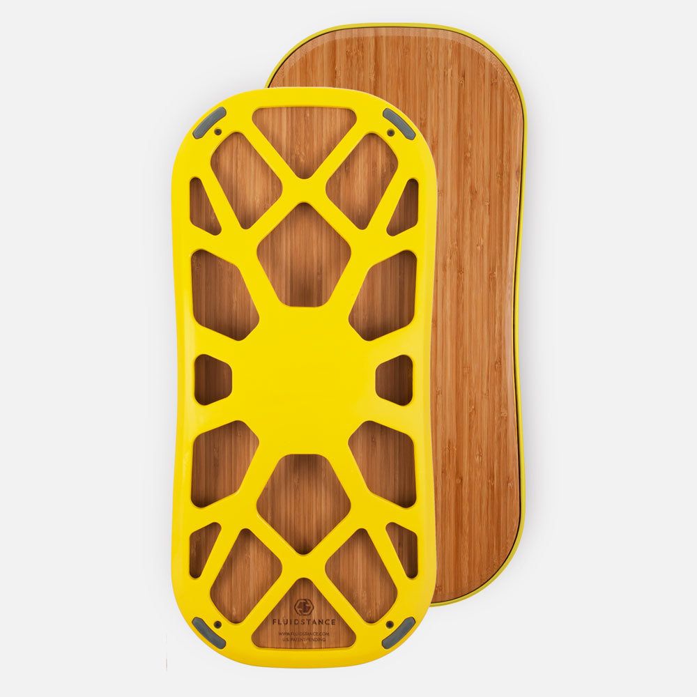 a yellow skateboard with a wooden board in the background