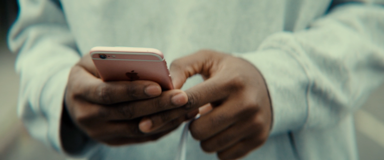 a close up of a person holding a cell phone