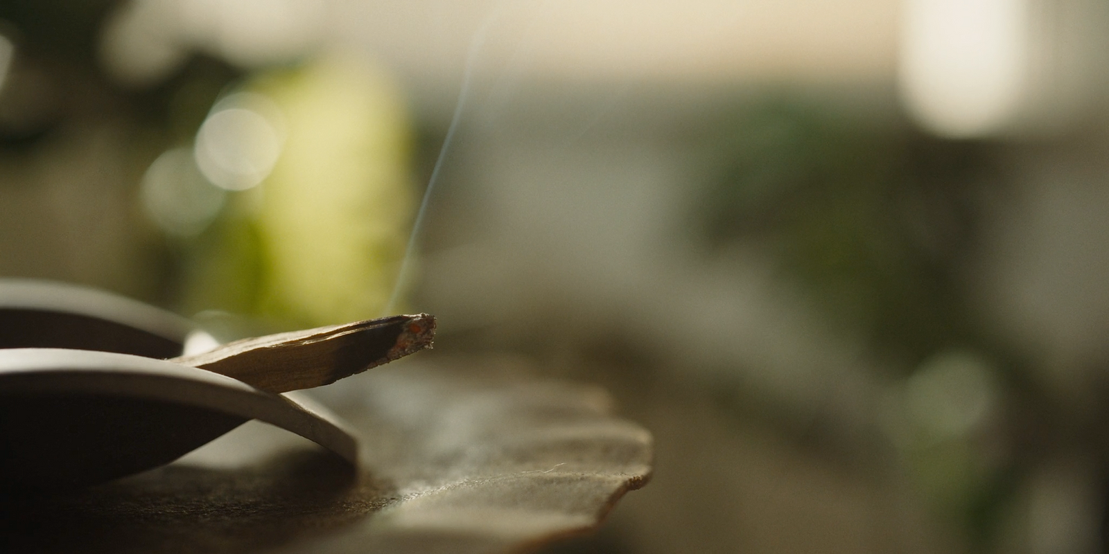 a close up of a wooden object with smoke coming out of it