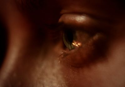 a close up of a person's eye with a blurry background