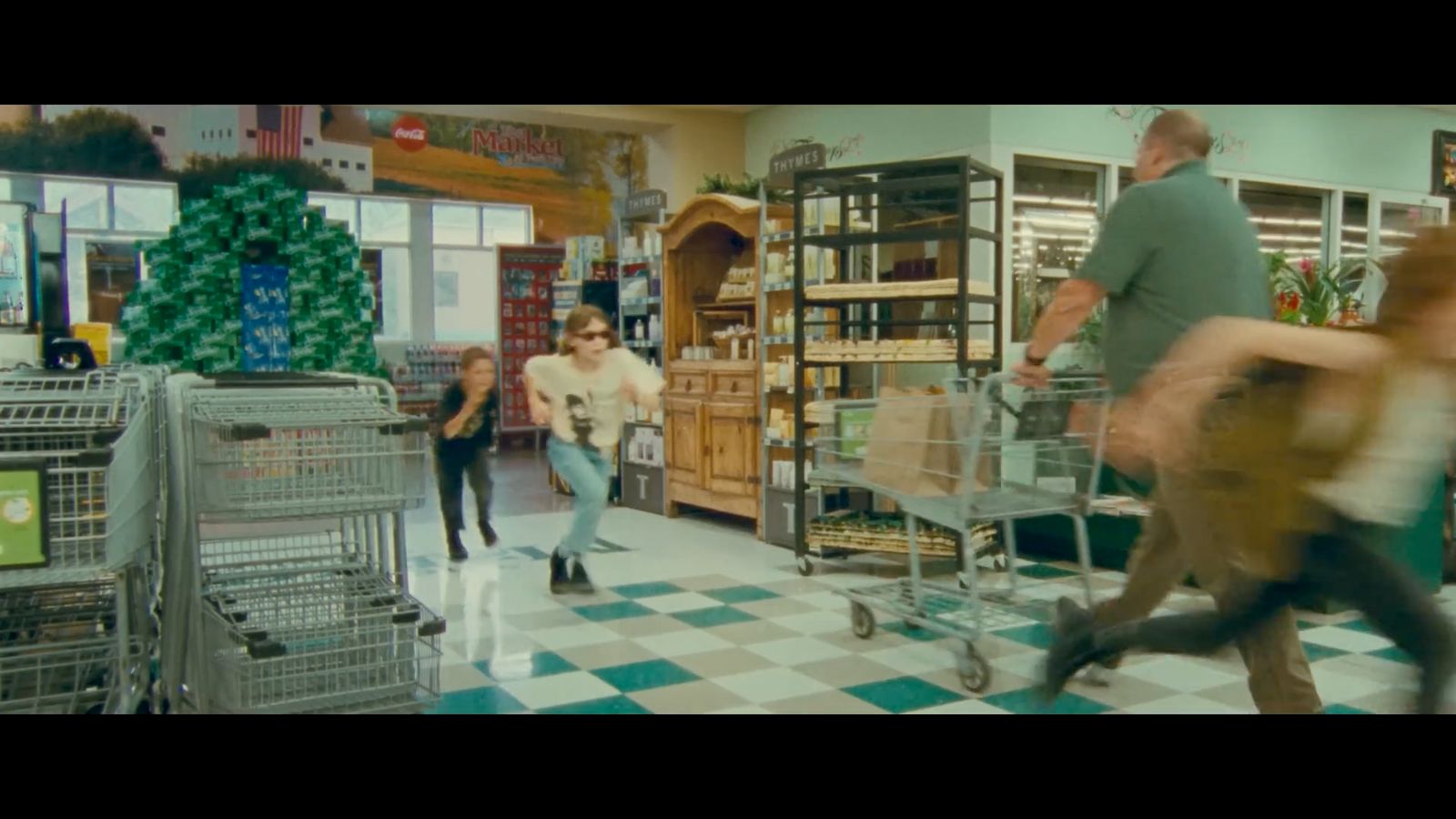 a group of people in a store with shopping carts