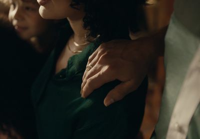 a close up of a person holding another person's hand