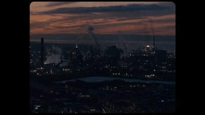 a view of a city at night from the top of a building