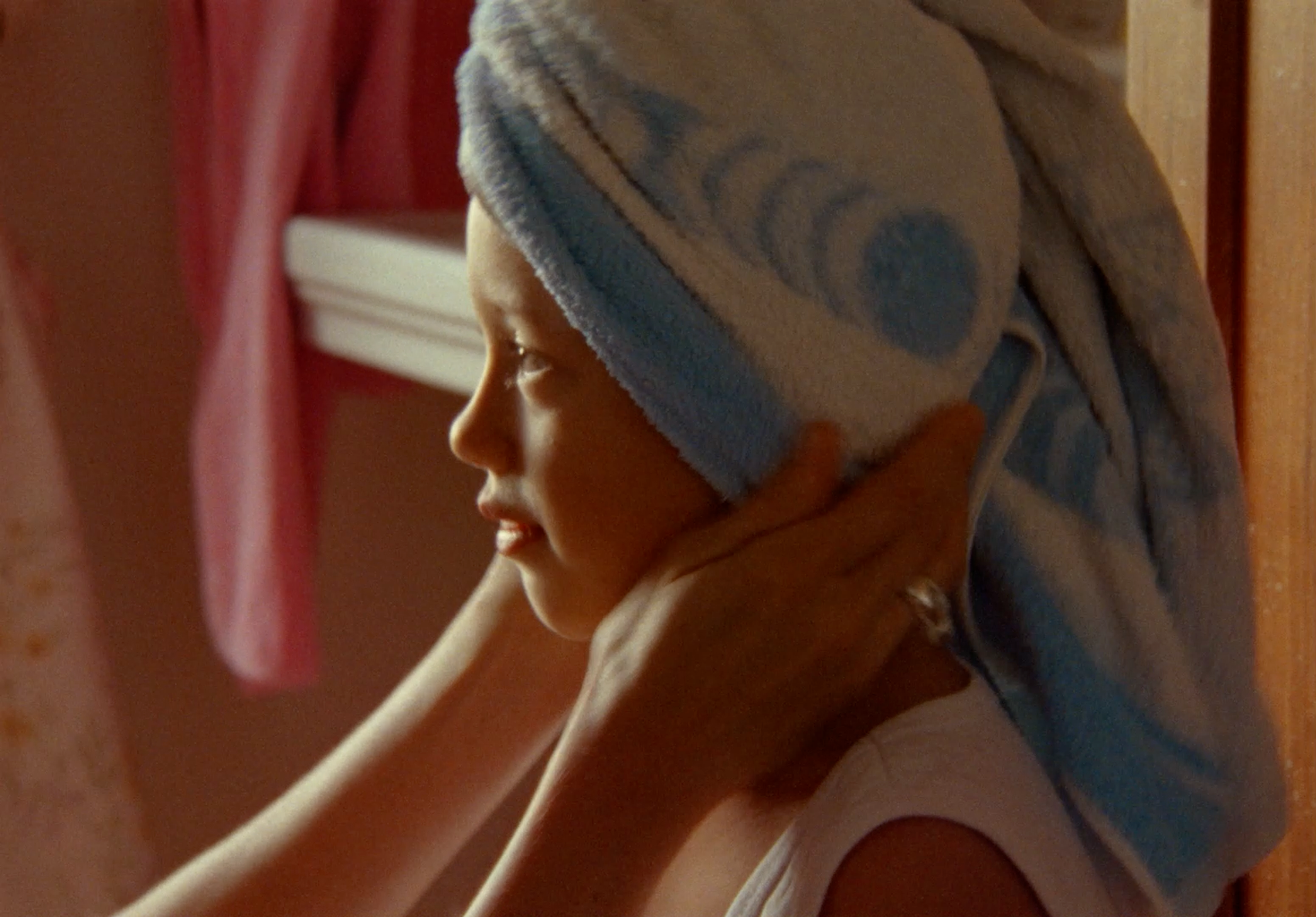 a woman with a towel wrapped around her head