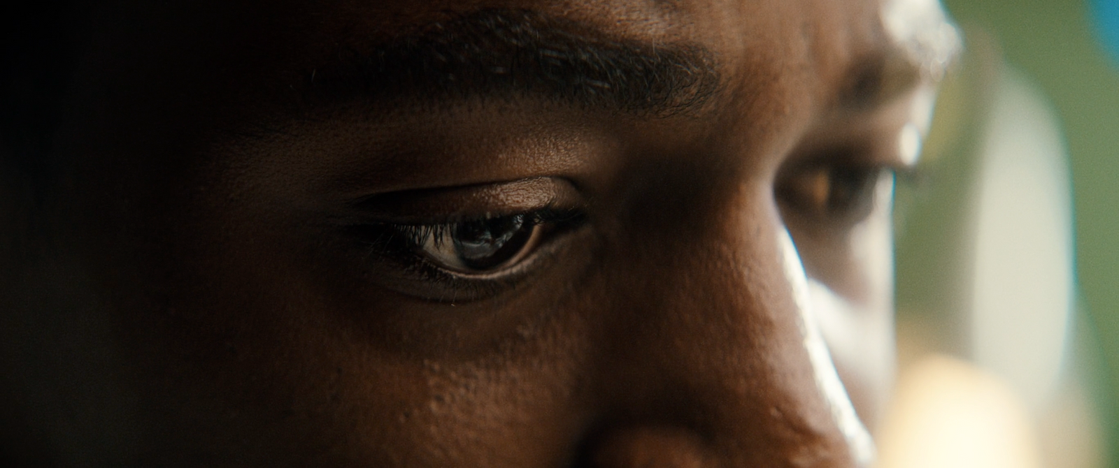 a close up of a person's eye with a blurry background