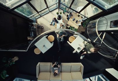 a group of people sitting around a table in a room