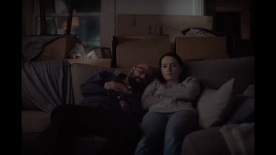 a man and a woman sitting on a couch