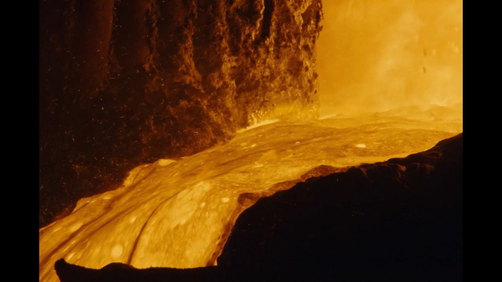 a close up of a rock with water coming out of it