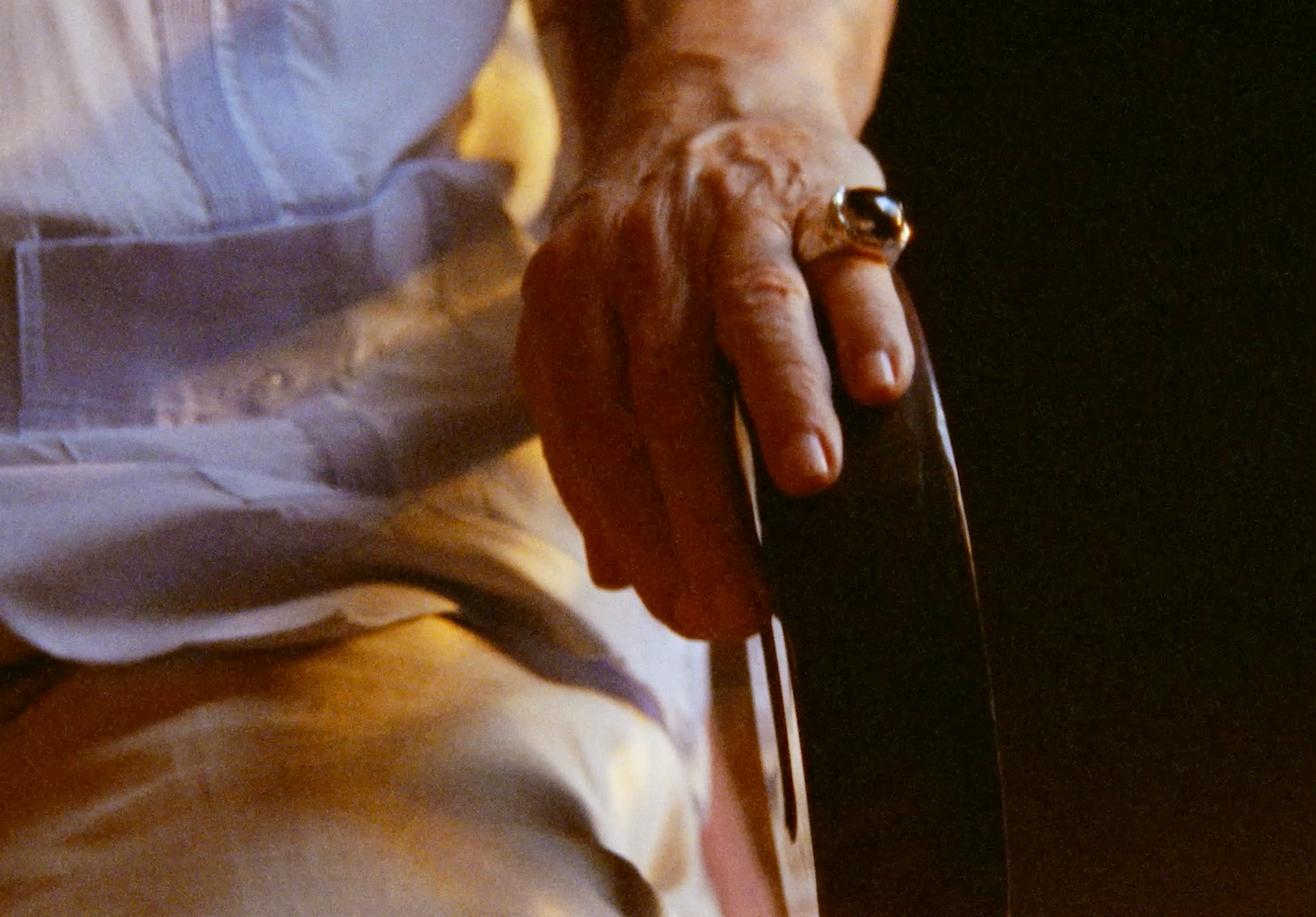 a close up of a person holding a tie