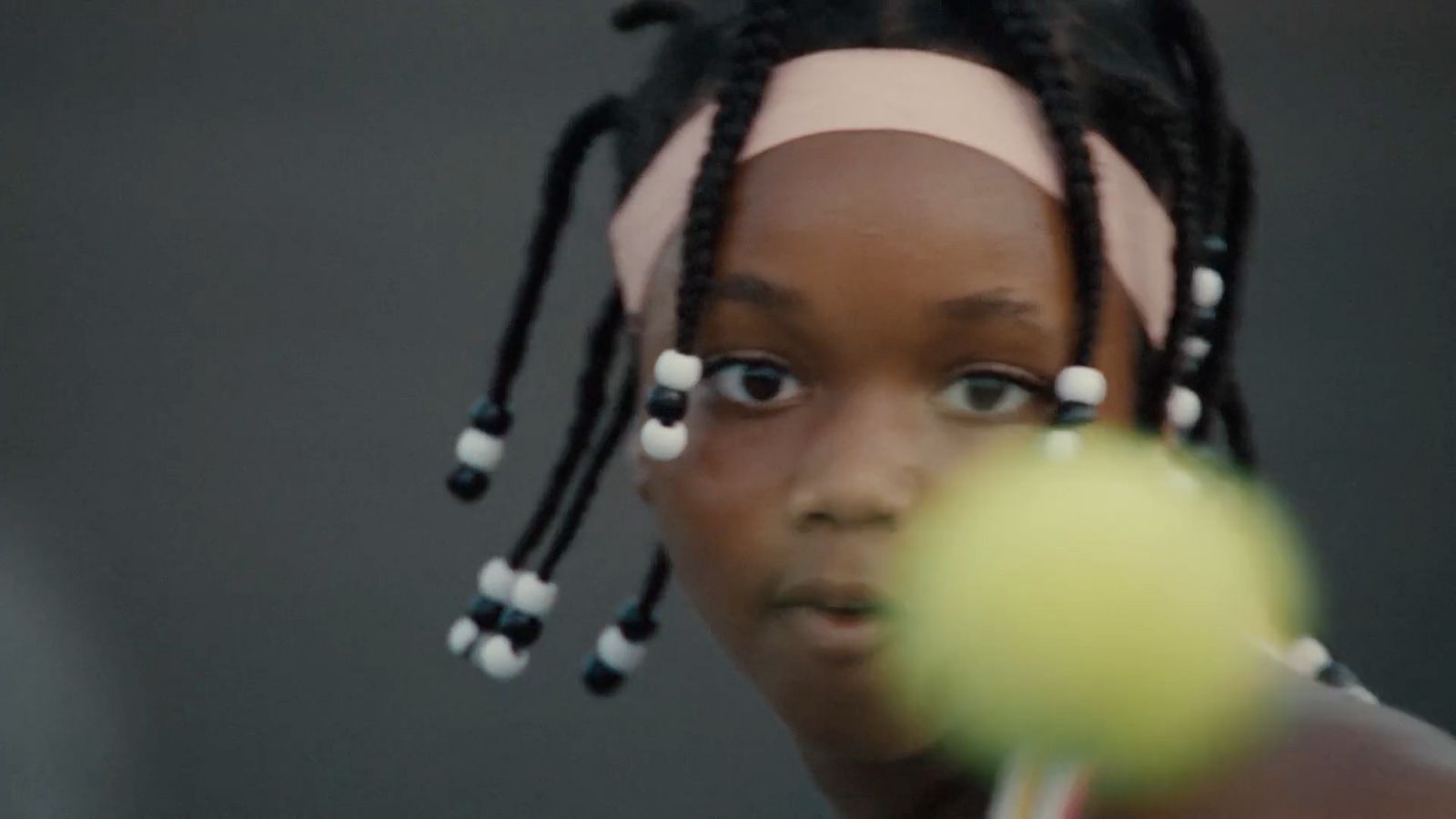 a woman with a tennis racket hitting a tennis ball