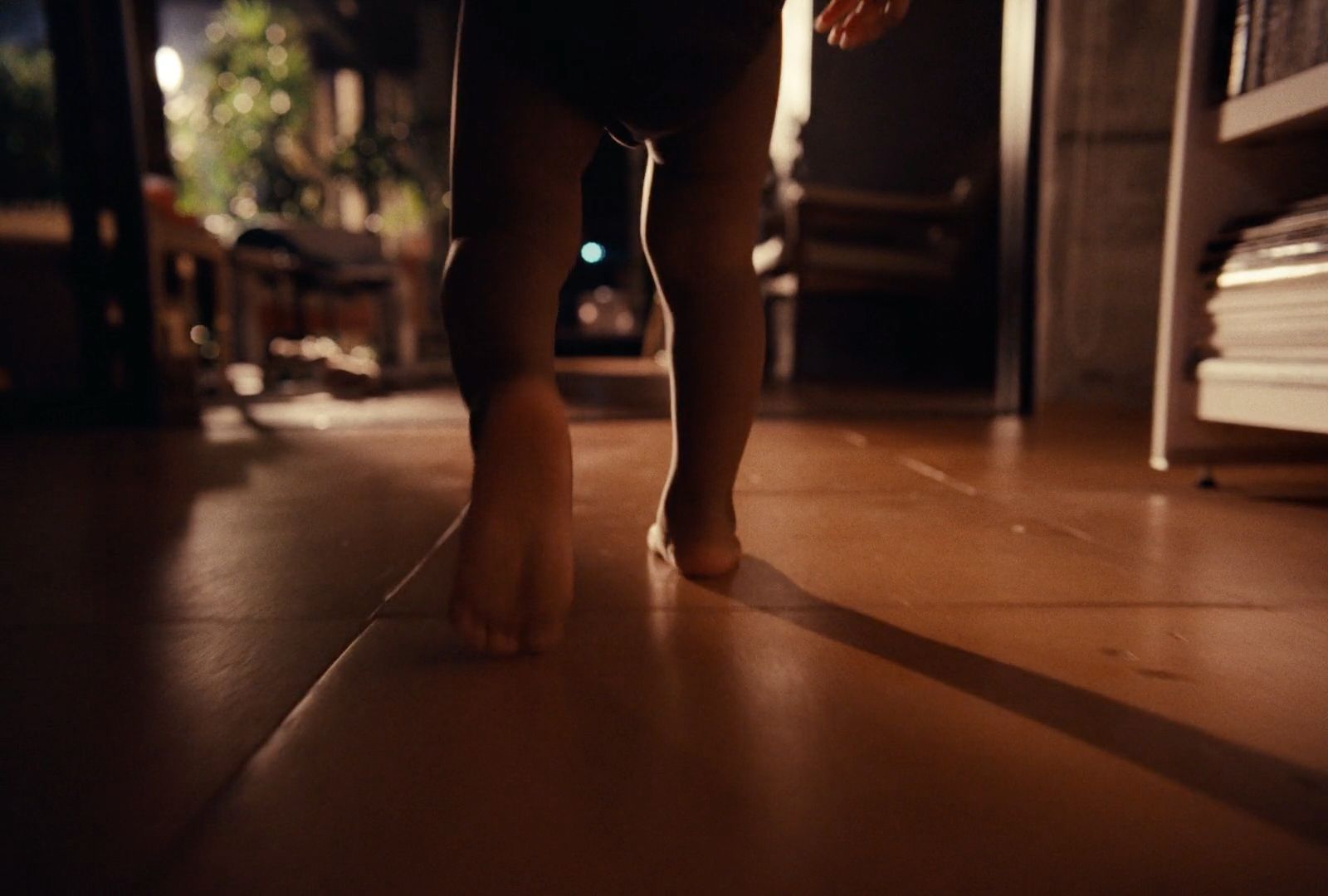 a person standing on a hard wood floor