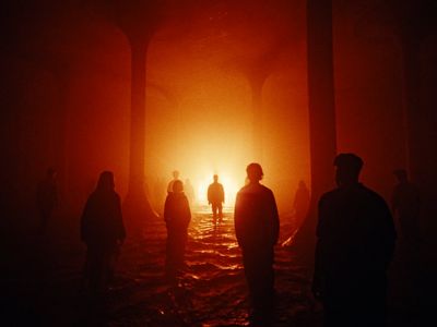 a group of people standing in the dark