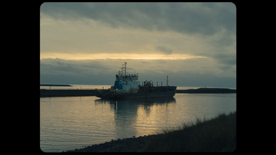 a large boat floating on top of a body of water