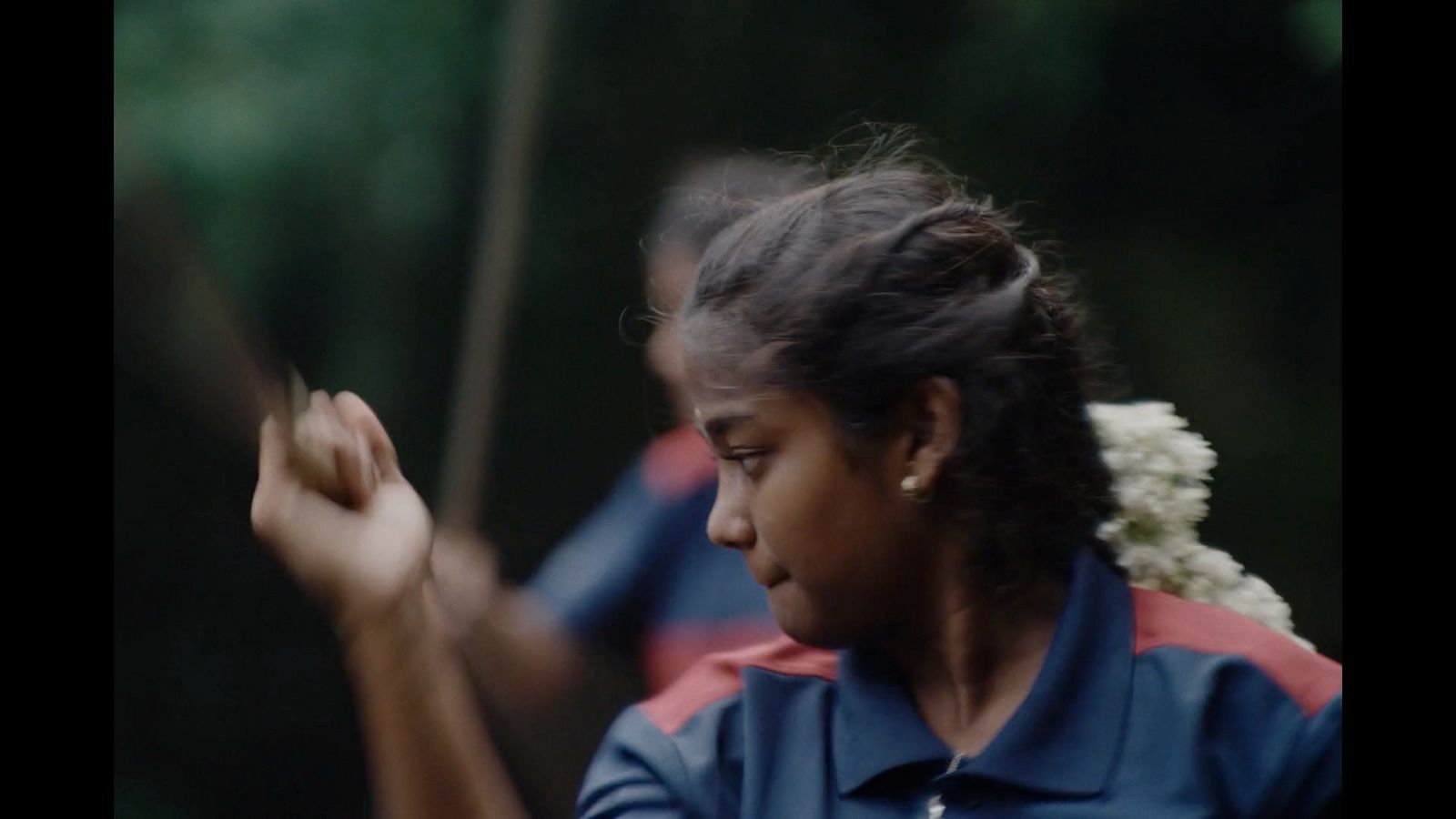 a woman holding a frisbee in her right hand