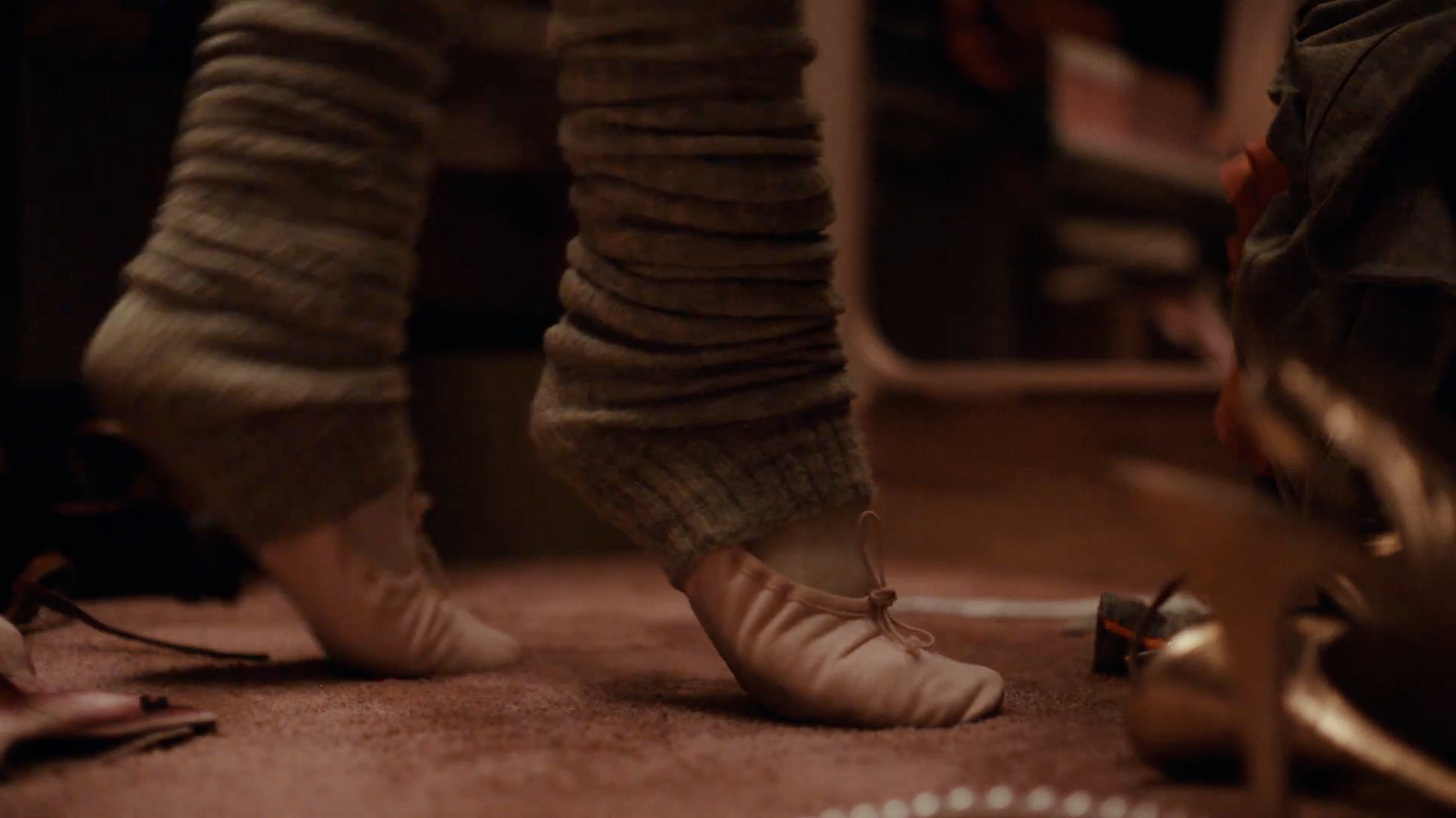 a close up of a person's feet wearing ballet shoes