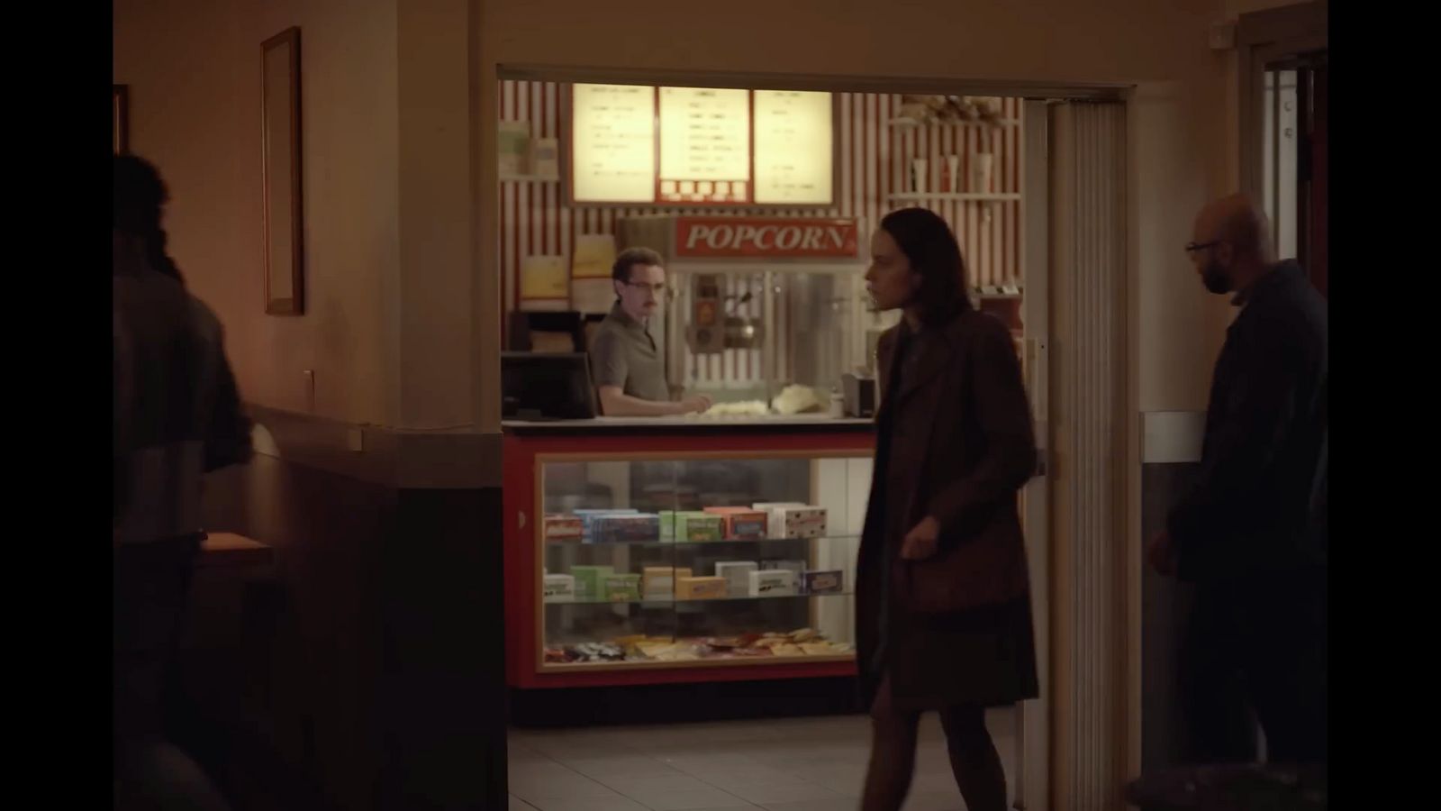 a woman standing in front of a vending machine