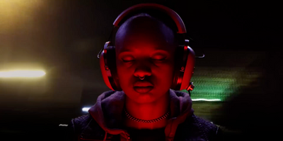 a man wearing headphones in a dark room