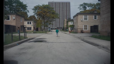 a person riding a skateboard down a street