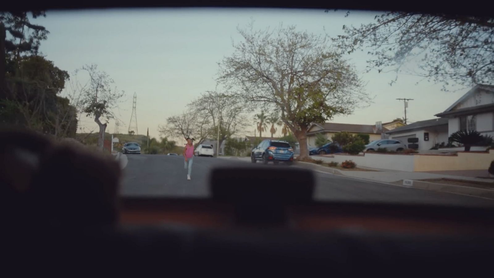 a view of a street from inside a car