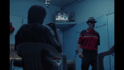 a man standing in front of a tv in a room