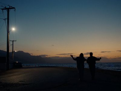 a couple of people that are standing in the street