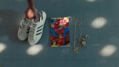 a person standing next to a book and a chain