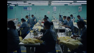 a group of people working on sewing machines