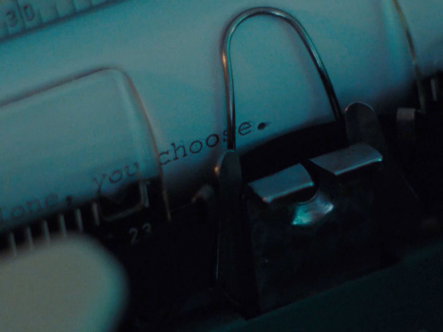 a close up of a typewriter with a blue background