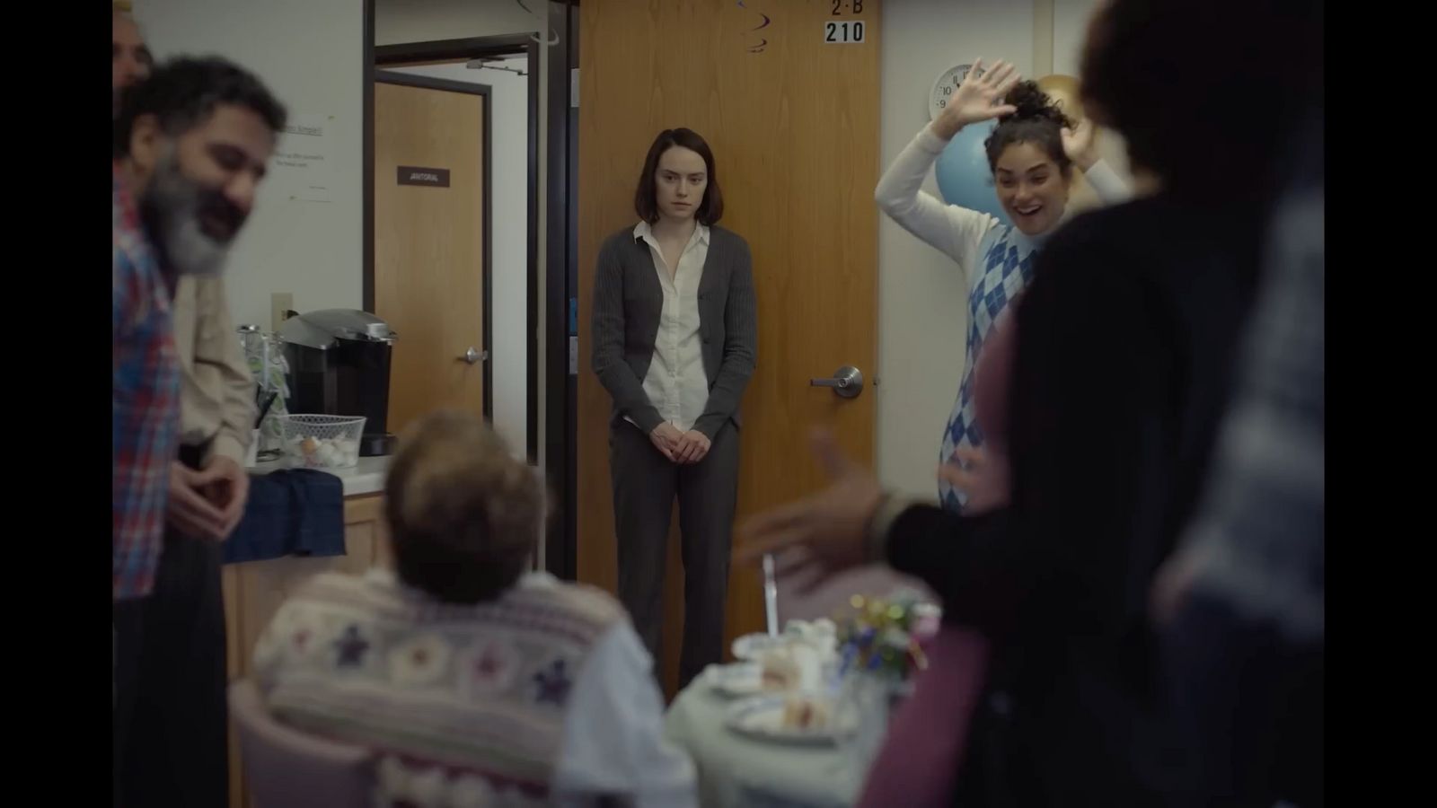 a group of people standing in a room