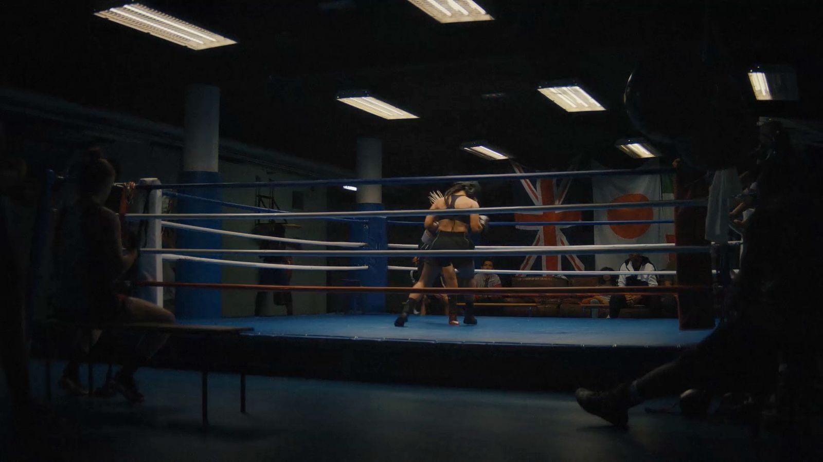 a boxing ring with two women in it