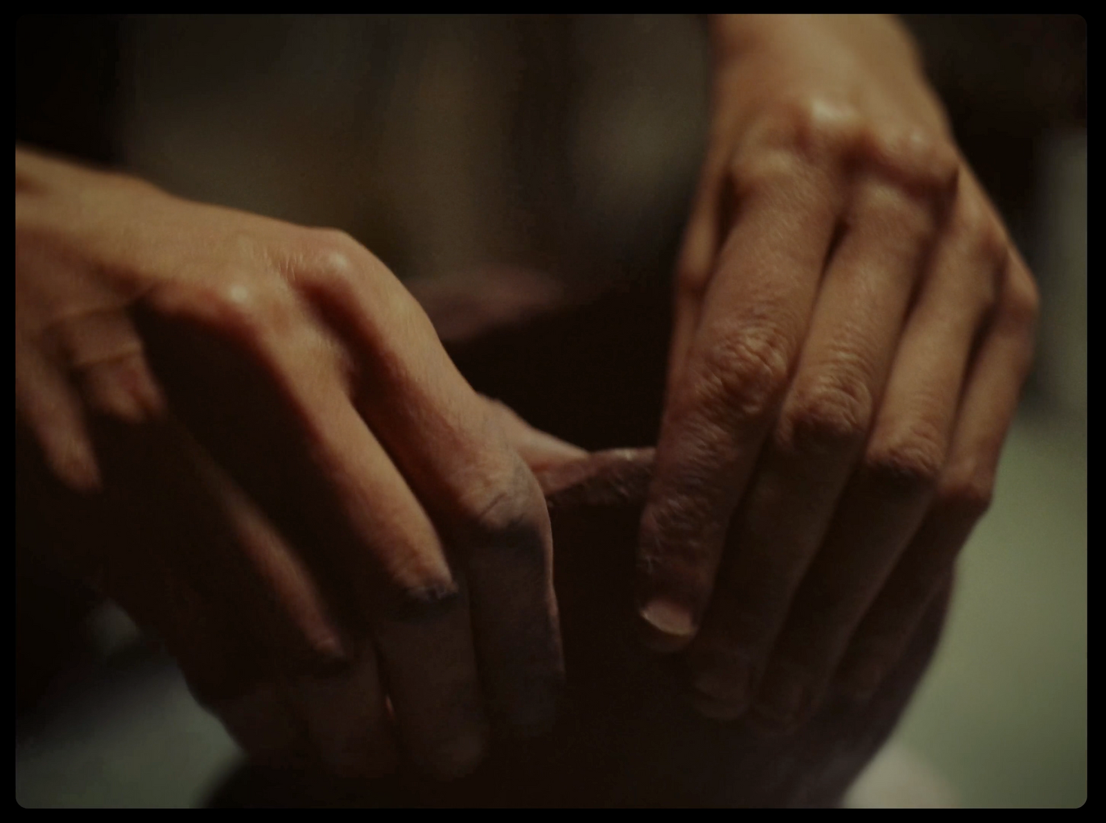 a close up of a person's hands holding something