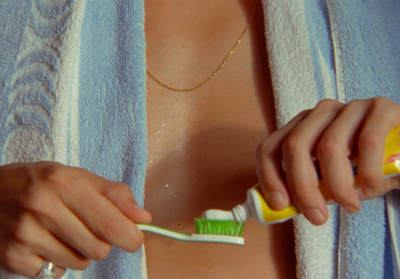 a close up of a person brushing their teeth