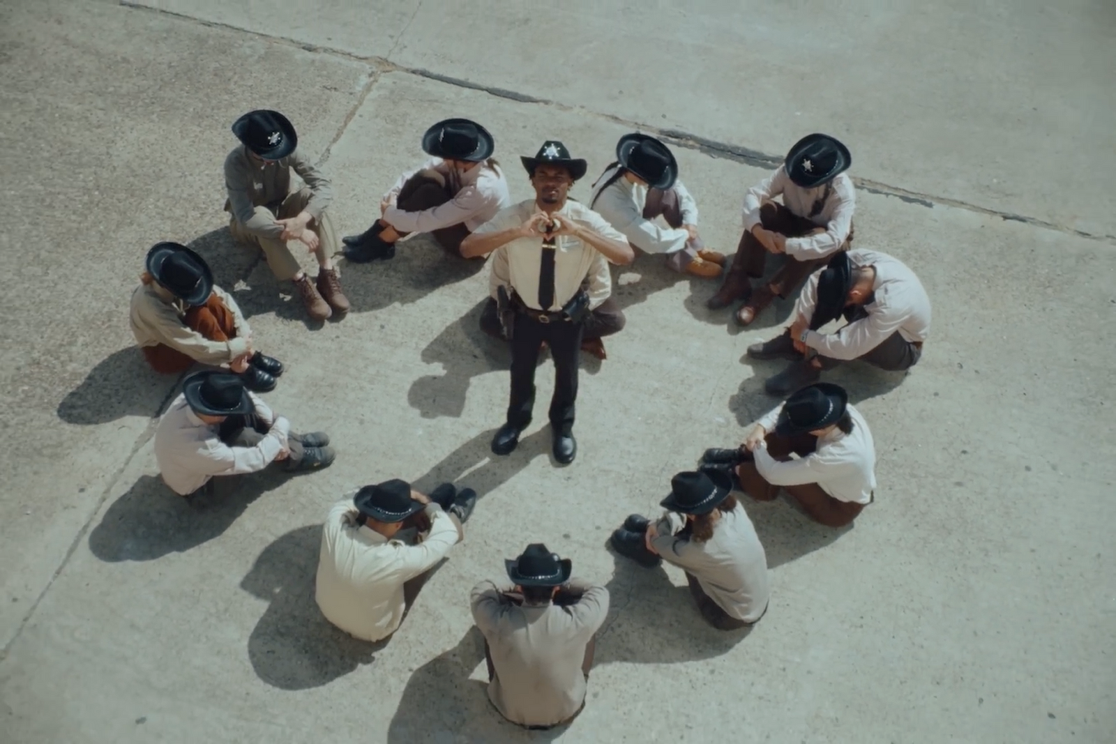 a group of men sitting around each other