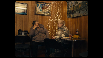 a couple of people sitting at a table