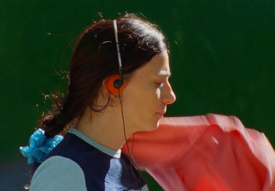 a woman with a red scarf around her neck