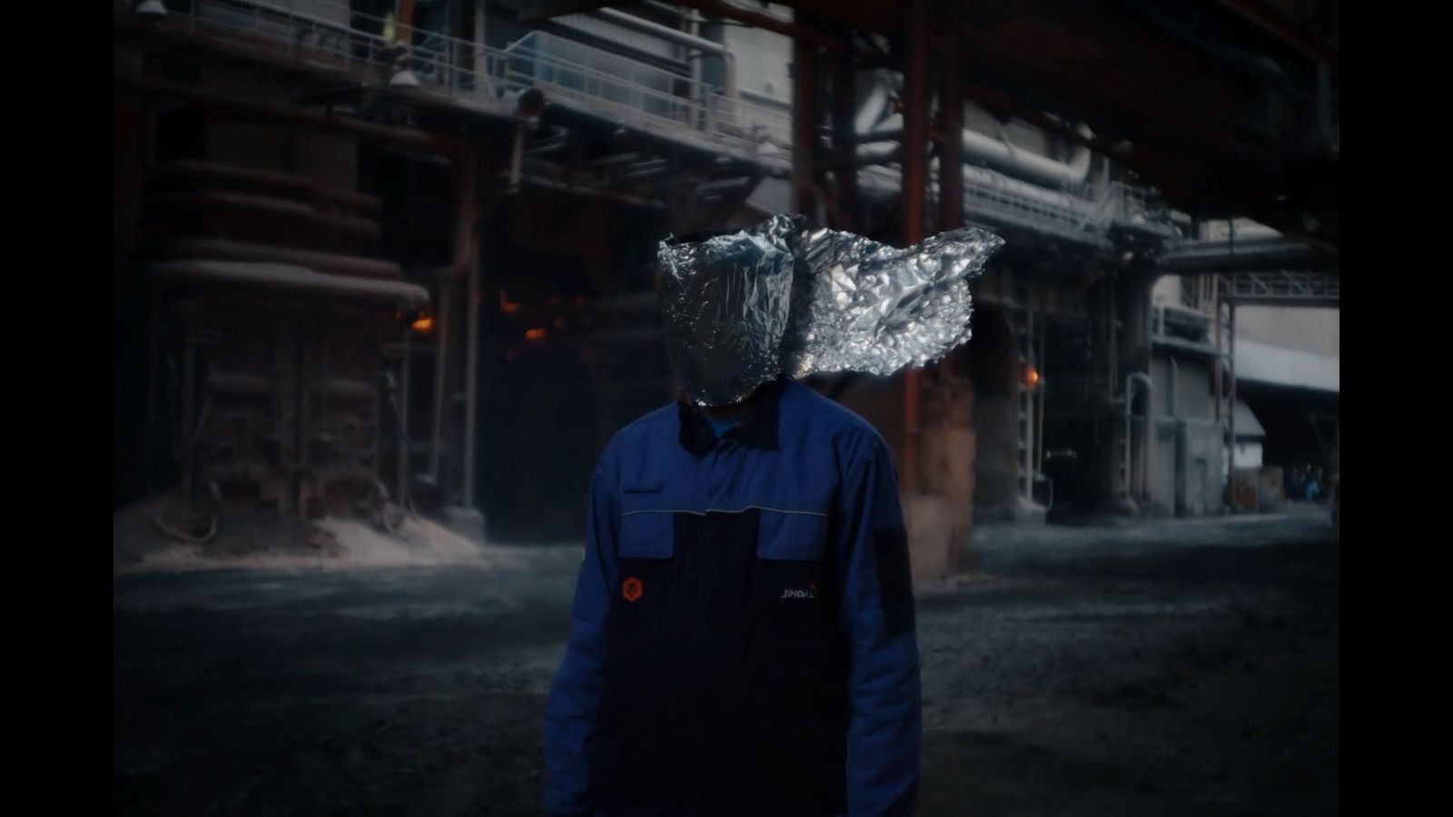 a man wearing a silver foil covering his head