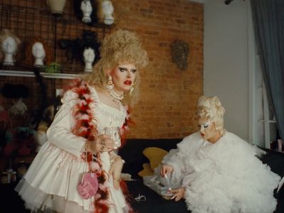 a couple of women sitting next to each other